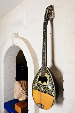 Musical instrument as a decoration of Greek restaurant clipart