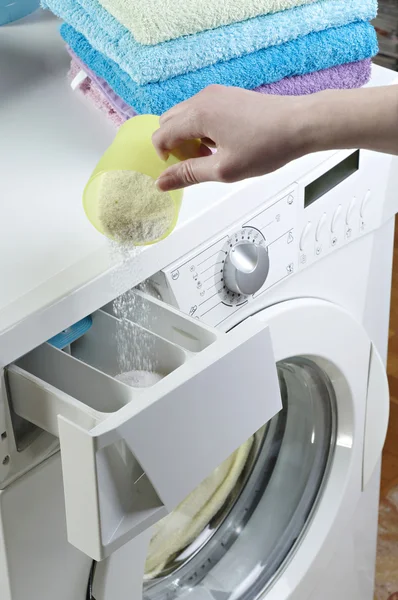 Woman pouring washing powder — Stock Photo, Image