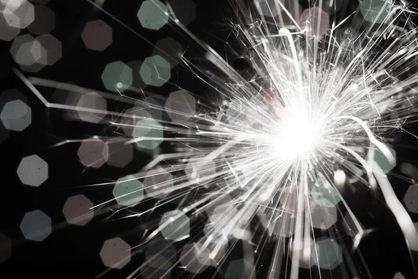 Sparkler on blurred background — Stock Photo, Image