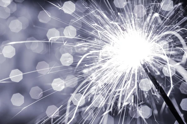 Sparkler on blurred background — Stock Photo, Image