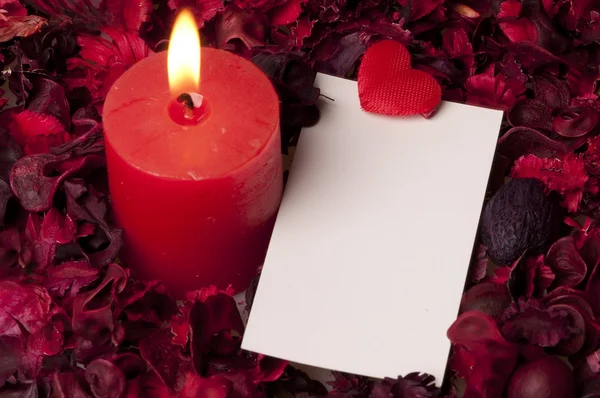 Red candle with label — Stock Photo, Image