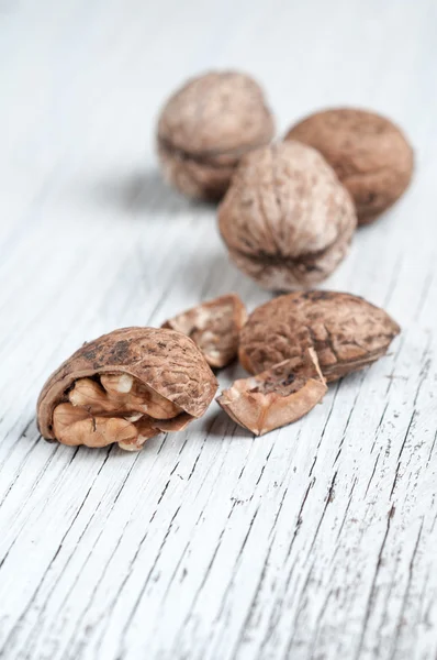 Dried walnuts on wooden table — Stock Photo, Image