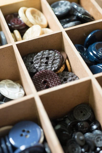 Buttons in wooden box — Stock Photo, Image