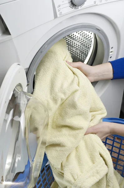 Hands holding dirty clothes — Stock Photo, Image