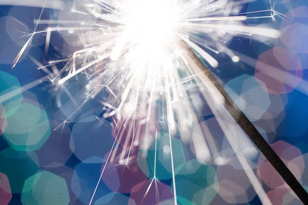 Sparkler on blurred background — Stock Photo, Image