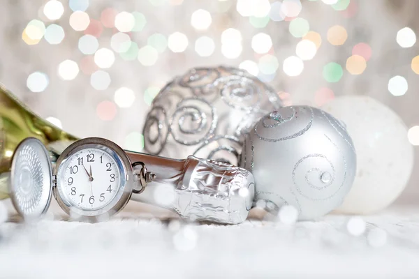 Clock and bottle of champagne — Stock Photo, Image