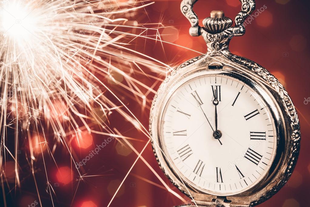 New year clock on abstract background