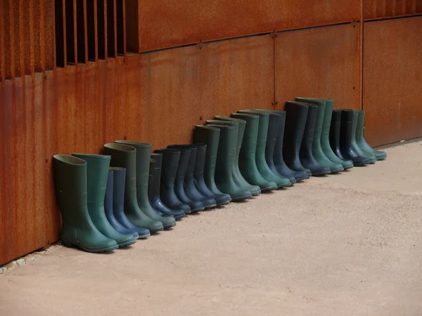 Rubber boots in formation — Stock Photo, Image