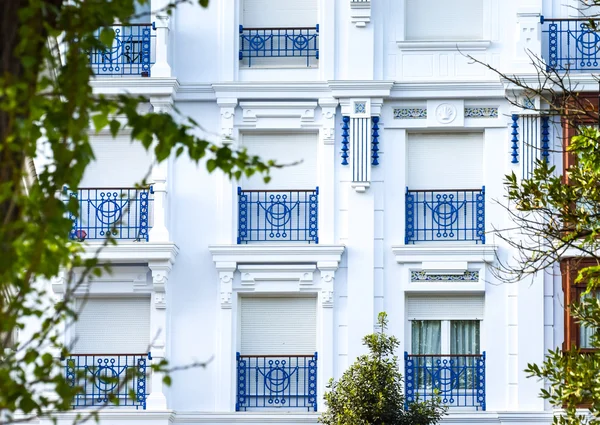White windows, blue railings — Stock Photo, Image