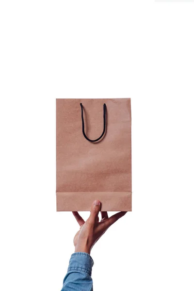 Mano Hombre Con Una Manga Azul Sostiene Una Bolsa Cartón —  Fotos de Stock