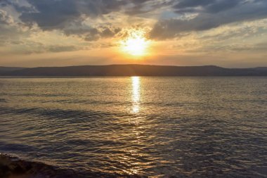 Sunset over the Sea of Galilee and Golan Heights clipart