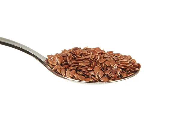 Brown flax seeds on a teaspoon — Stock Photo, Image