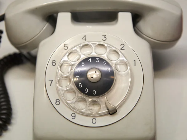 Altes gebrauchtes Telefon mit Drehscheibe — Stockfoto