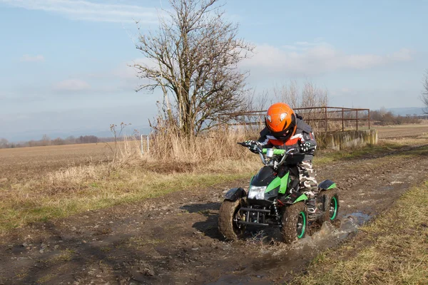 Boy rides on electric ATV quad. — Stock Photo, Image