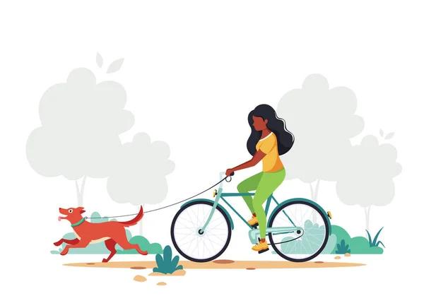 黑人妇女骑着自行车带着狗在公园里 健康的生活方式 户外活动的概念 矢量说明 — 图库矢量图片