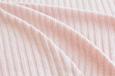 Kumaşın dokusu pastel renk arkaplanı, dalgalı kumaş kıvrımları