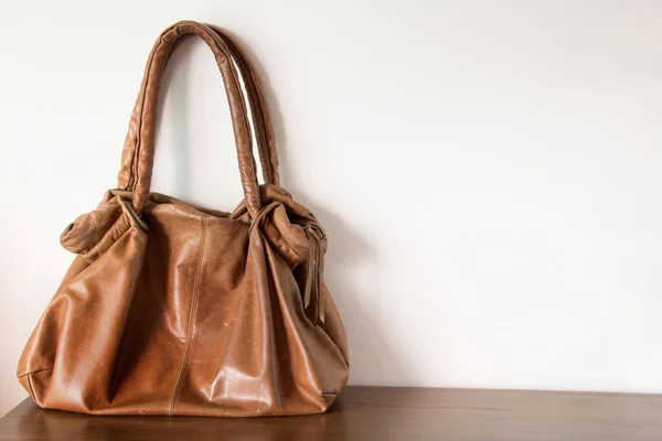 Female Leather Handbag Table White Wall — Stock Photo, Image