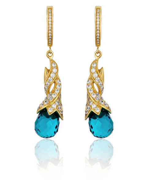 Gold earrings with gemstones — Stock Photo, Image