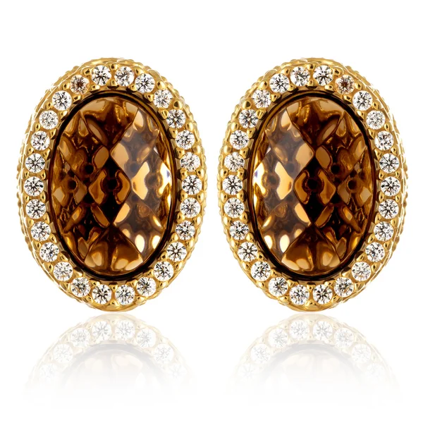 Gold earrings with gemstones — Stock Photo, Image