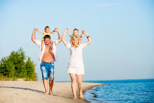 Happy family on the beach Stock Picture