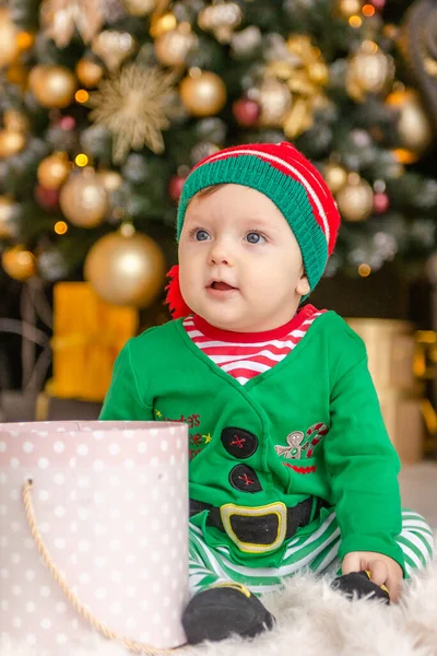 Cute Little Boy Dressed Elf Opens Christmas Present Decorated Christmas — Stock Photo, Image