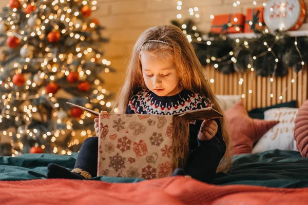 Excited Girl Opens Gift Box Santa Claus Happy Childhood Holiday — Stock Photo, Image