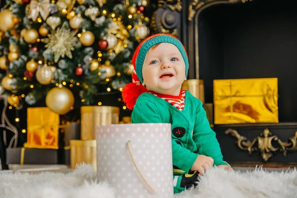 Cute Little Boy Dressed Elf Opens Christmas Present Decorated Christmas — Stock Photo, Image