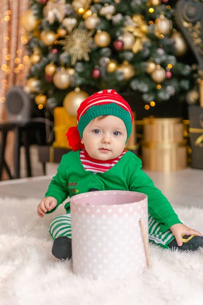 Cute Little Boy Dressed Elf Opens Christmas Present Decorated Christmas — Stock Photo, Image