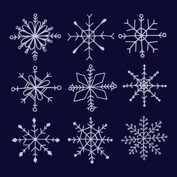 Set Ilustración vectorial de copos de nieve en conjunto de mano estilo garabato. Colección de copos de nieve para el diseño de invierno de Navidad. Eps 10. — Archivo Imágenes Vectoriales