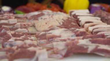 Raw Lamb skewers. Raw meat for shish kebab on skewers. Video