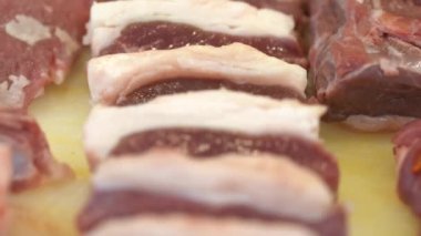 Raw Lamb skewers. Raw meat for shish kebab on skewers. Video