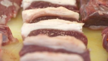 Raw Lamb skewers. Raw meat for shish kebab on skewers. Video