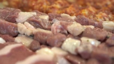 Raw Lamb skewers. Raw meat for shish kebab on skewers. Video