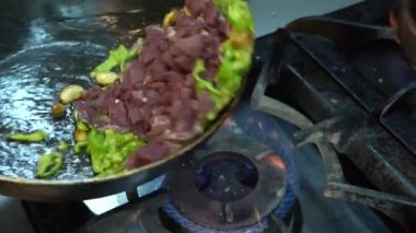 Cooking meat saute. Pieces of meat diced fried in a pan close-up video. Stewing beef and vegetables.