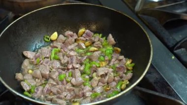 Cooking meat saute. Pieces of meat diced fried in a pan close-up video. Stewing beef and vegetables.