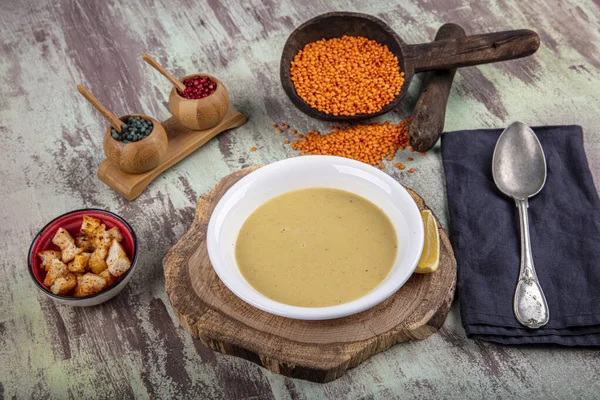 Lentil soup with kruton bread in a ceramic white bowl on a wooden background — Stock Image Lentil Soup Kruton Bread Ceramic White Bowl Wooden Background Stock Image