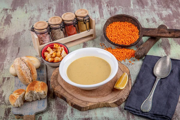 Lentil soup with kruton bread in a ceramic white bowl on a wooden background — Stock Image Lentil Soup Kruton Bread Ceramic White Bowl Wooden Background Stock Image