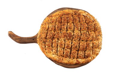 Ramadan Pita (Ramazan Pidesi) Traditional Turkish bread for holy month Ramadan. Fresh sliced pita bread . clipart
