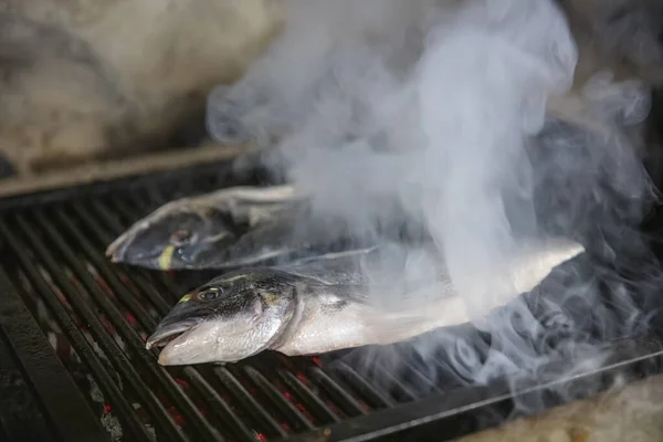 Sea bream fish on the grill. Grilled fish dish sea bream restaurant service