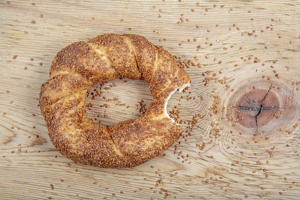 Turkish fast food bagel called Simit. Turkish bagel Simit with sesame. Bagel is traditional Turkish bakery food. Turkish crunchy round braided bagel with sesame seeds.