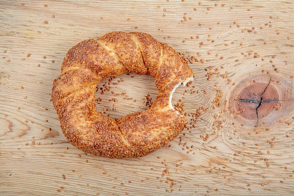 Turkish fast food bagel called Simit. Turkish bagel Simit with sesame. Bagel is traditional Turkish bakery food. Turkish crunchy round braided bagel with sesame seeds.