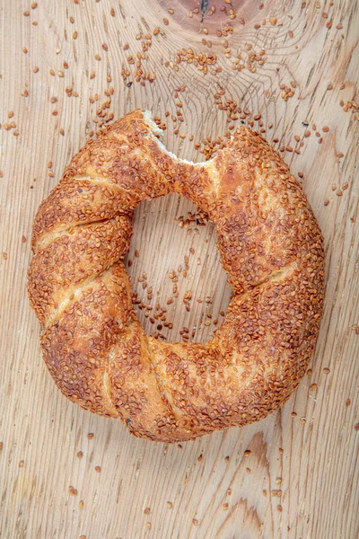 Turkish fast food bagel called Simit. Turkish bagel Simit with sesame. Bagel is traditional Turkish bakery food. Turkish crunchy round braided bagel with sesame seeds.