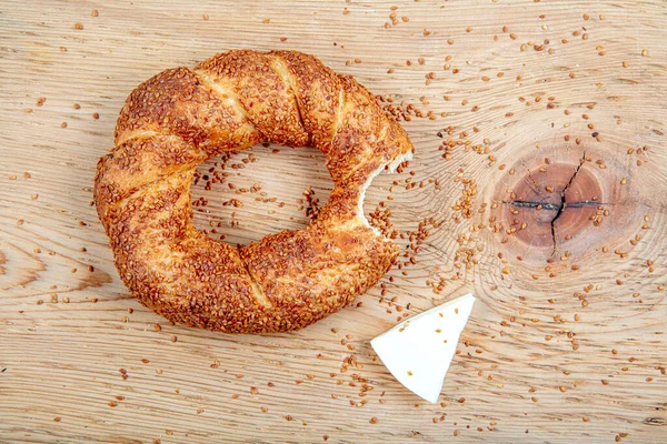 Turkish fast food bagel called Simit. Turkish bagel Simit with sesame. Bagel is traditional Turkish bakery food. Turkish crunchy round braided bagel with sesame seeds.