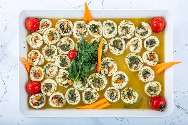 Turkish cuisine appetizers; Sea Bass beyti, delicious sea bass rolls.