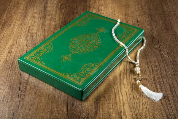 Bismillah - Mean In The Name Of Allah Arabic art with Koran - holy book of Muslims ( public item of all muslims ) .