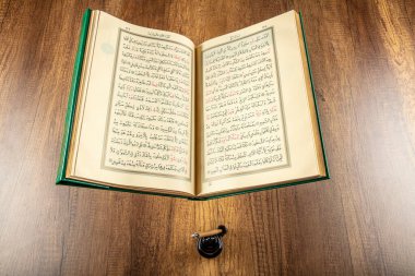 Istanbul, Turkey - April 5, 2015; A Quran book opened with a rosary. Quran - holy book of innocent Muslims (breadth of all Muslims).
