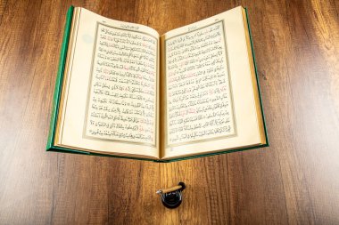 Istanbul, Turkey - April 5, 2015; A Quran book opened with a rosary. Quran - holy book of innocent Muslims (breadth of all Muslims).