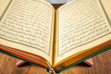 Istanbul, Turkey - April 5, 2015; A Quran book opened with a rosary. Quran - holy book of innocent Muslims (breadth of all Muslims).