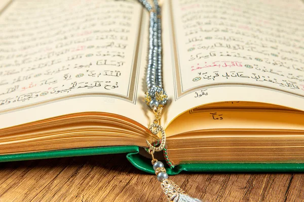 Istanbul, Turkey - April 5, 2015; A Quran book opened with a rosary. Quran - holy book of innocent Muslims (breadth of all Muslims).
