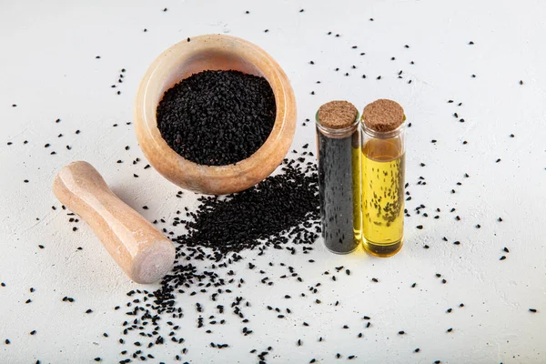 Black Cumin Seeds Bowl Essential Oil Glass Bottle Nigella Sativa — Stock Photo, Image